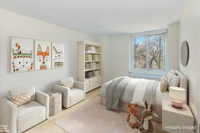 a bedroom with a bed and glass window