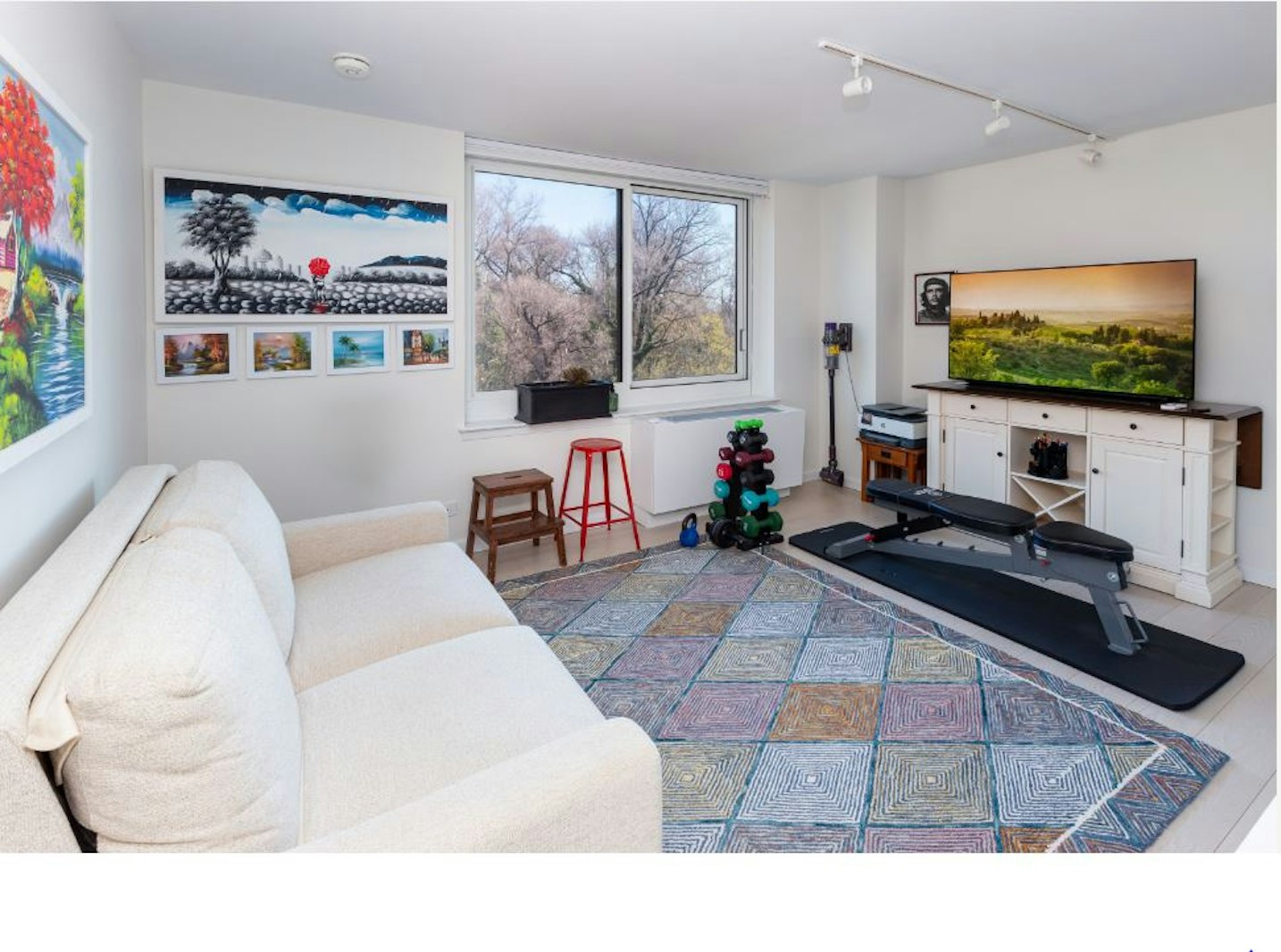 2521 Palisade Avenue, Unit 8C Bronx, NY 10463 - Photo 11 of 17 a living room with furniture and a flat screen tv