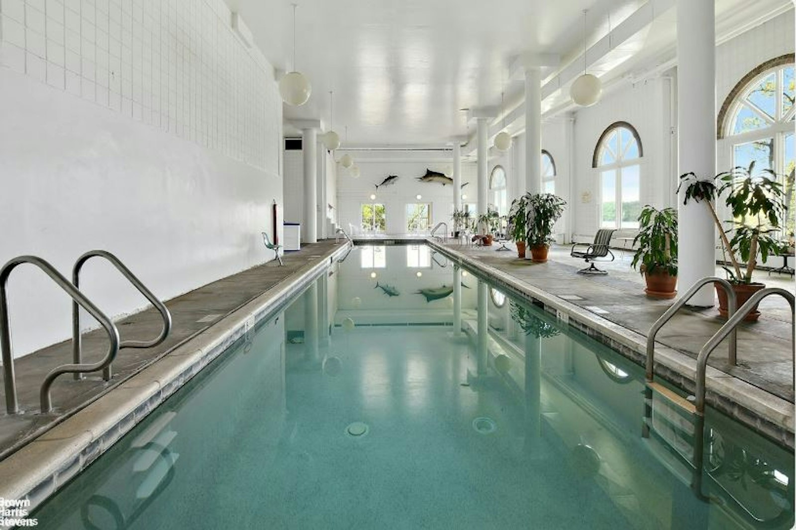 2521 Palisade Avenue, Unit 8C Bronx, NY 10463 - Photo 14 of 17 a view of a kitchen with kitchen island stainless steel appliances a sink and living room view