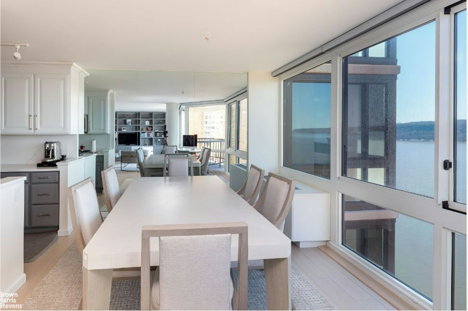 2521 Palisade Avenue, Unit 8C Bronx, NY 10463 - Photo 4 of 17 a view of a dining room with furniture window and wooden floor
