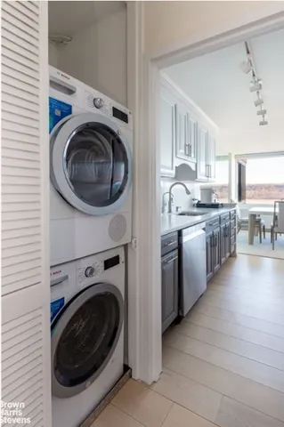 a view of a kitchen with a washer and dryer