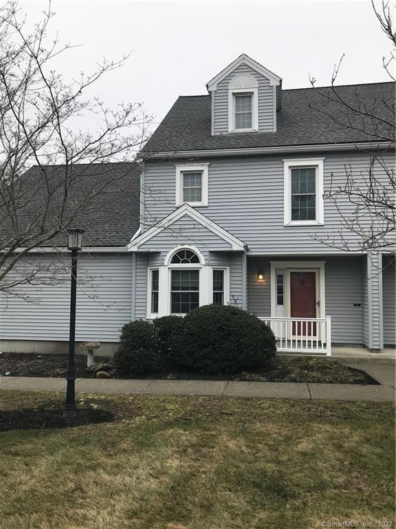 378 Meridian Street Extension, Unit 35 Groton, CT 06340 - Photo 1 of 1 a front view of a house with a yard
