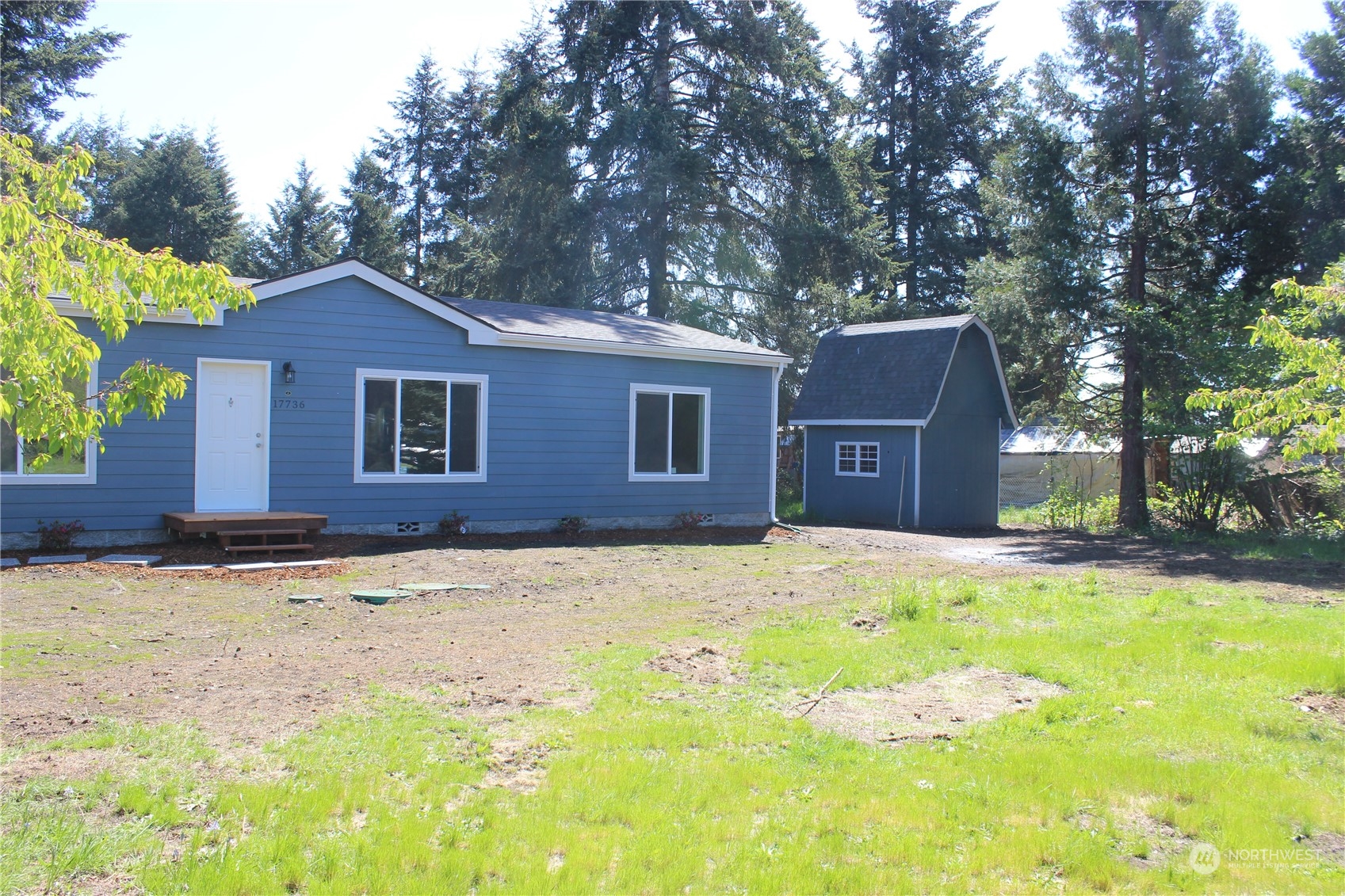 17736 Pendleton Street Southwest Rochester, WA 98579 - Photo 6 of 38 a front view of a house with a yard and garage