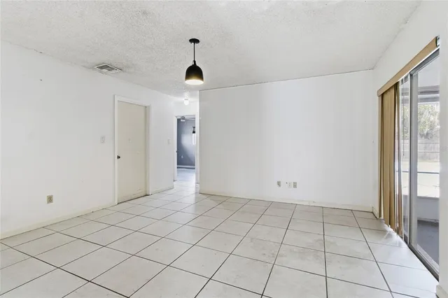 a view of an empty room and window in a room