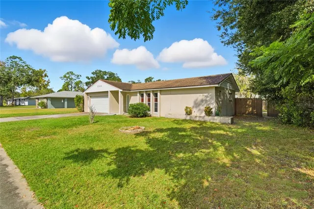 an aerial view of a house with a garden