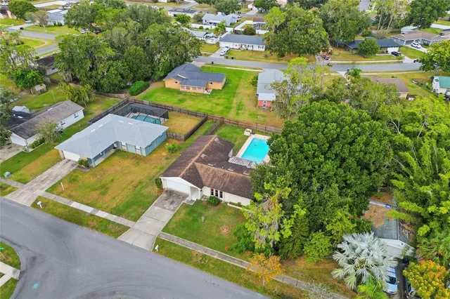 an aerial view of a house with a garden
