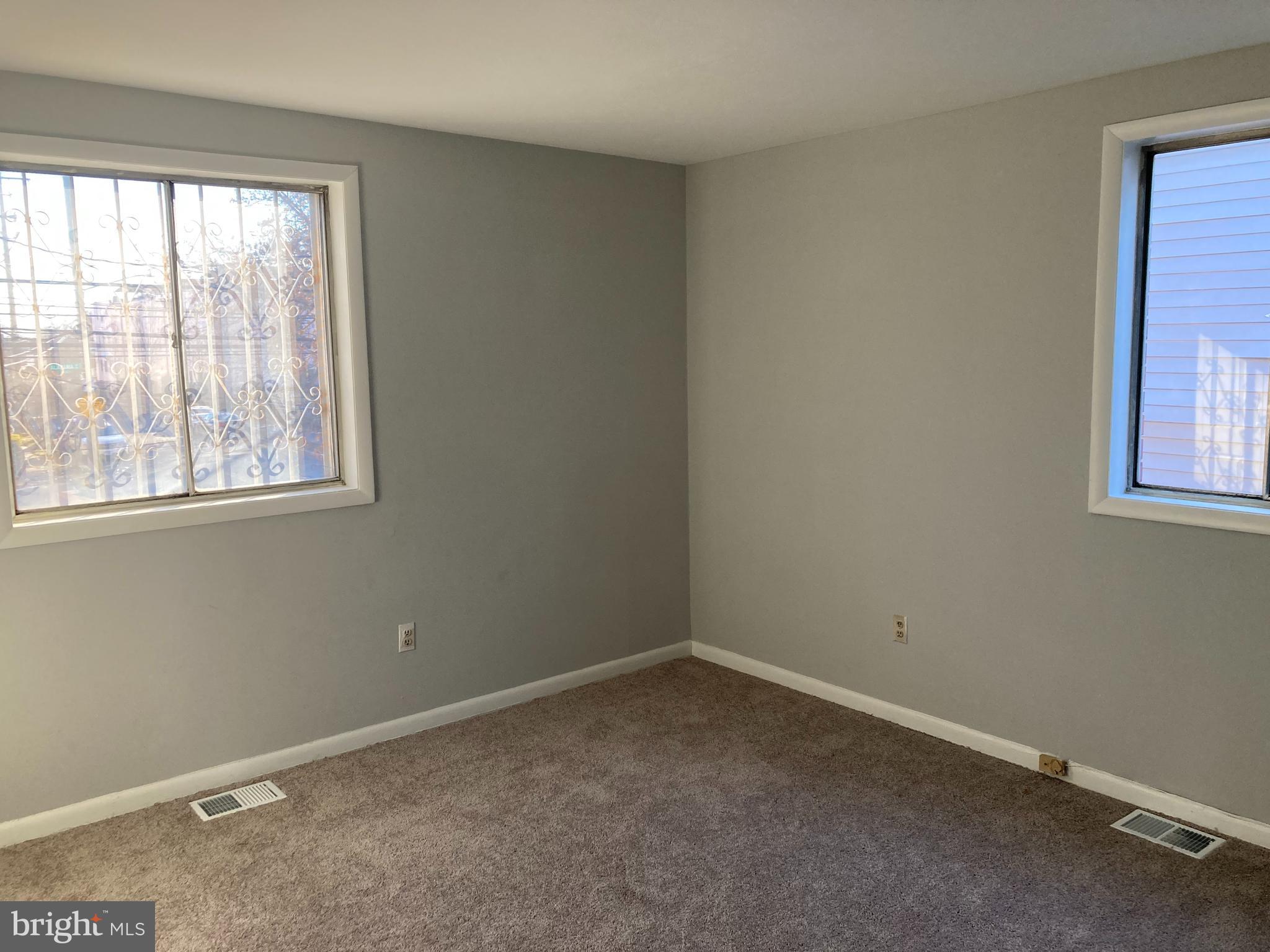 712 Alabama Avenue Southeast Washington, DC 20032 - Photo 13 of 15 an empty room with a window