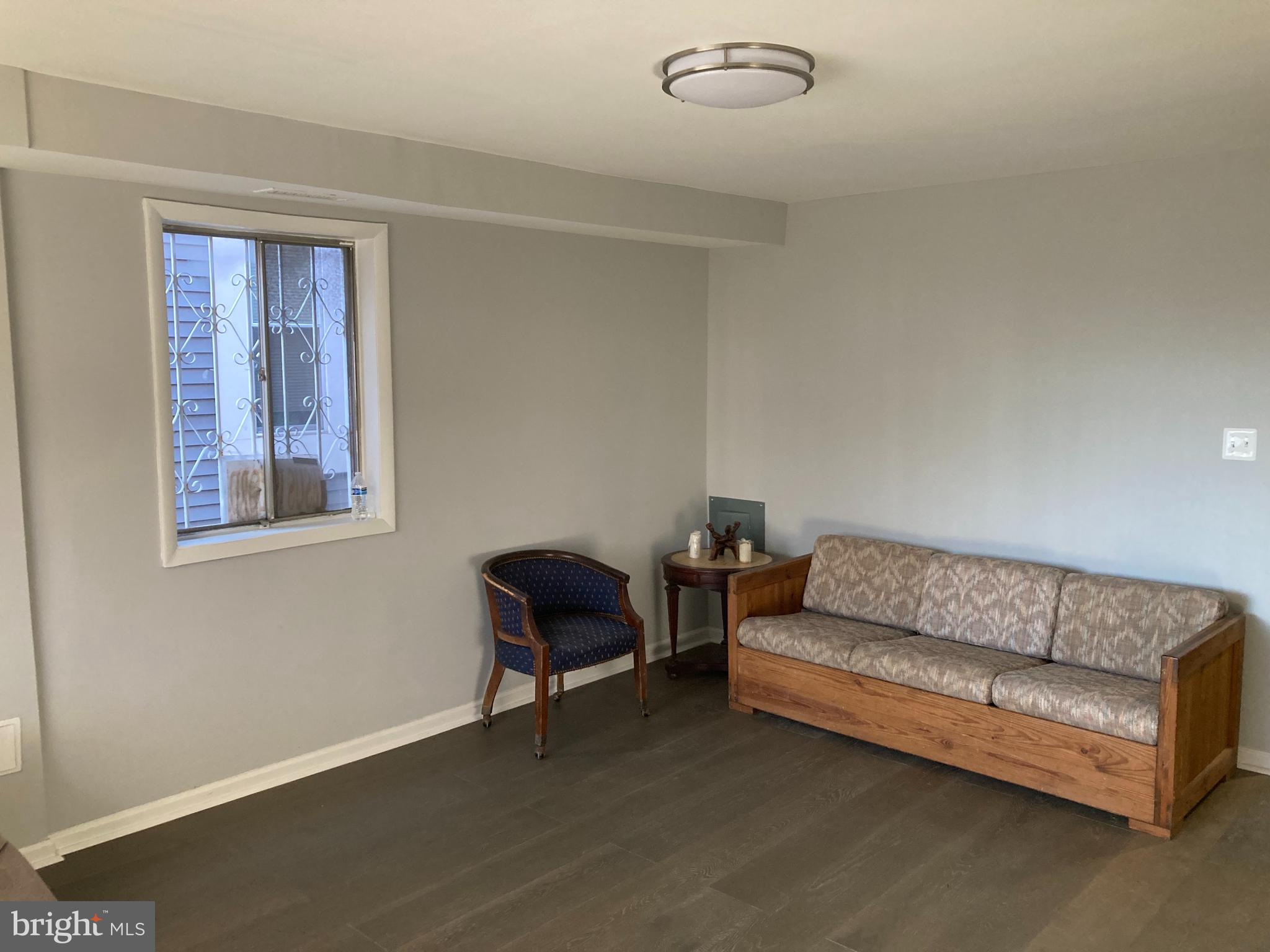 712 Alabama Avenue Southeast Washington, DC 20032 - Photo 3 of 15 a living room with furniture and a window