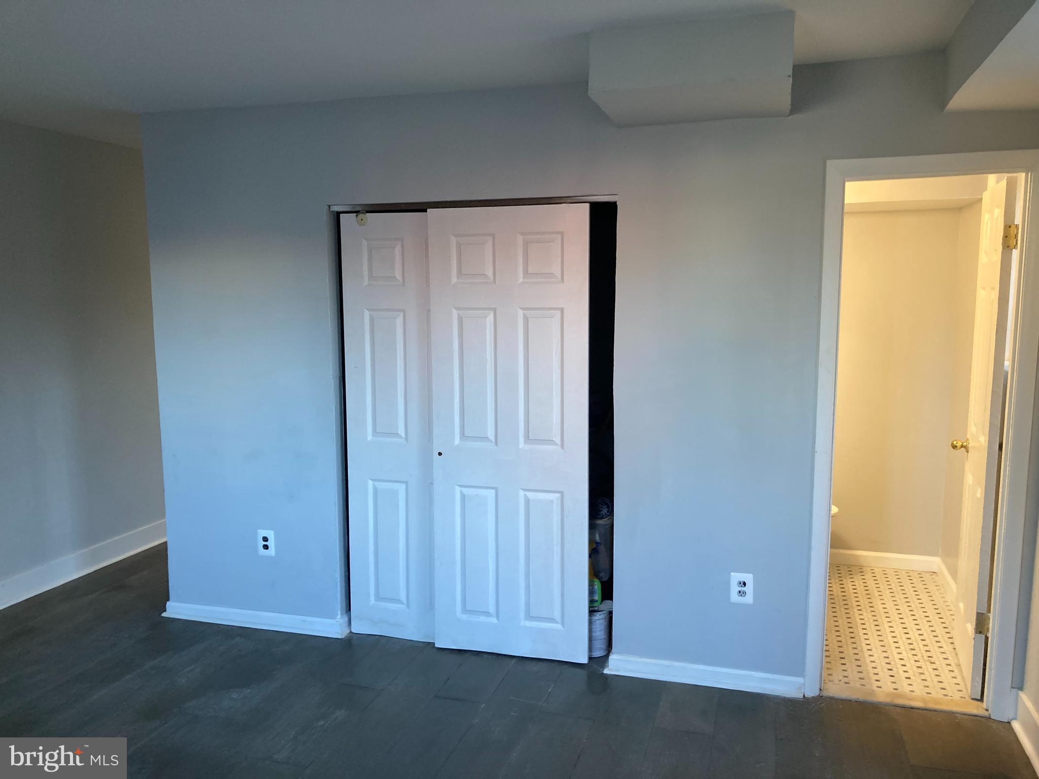 712 Alabama Avenue Southeast Washington, DC 20032 - Photo 9 of 15 an empty room with windows
