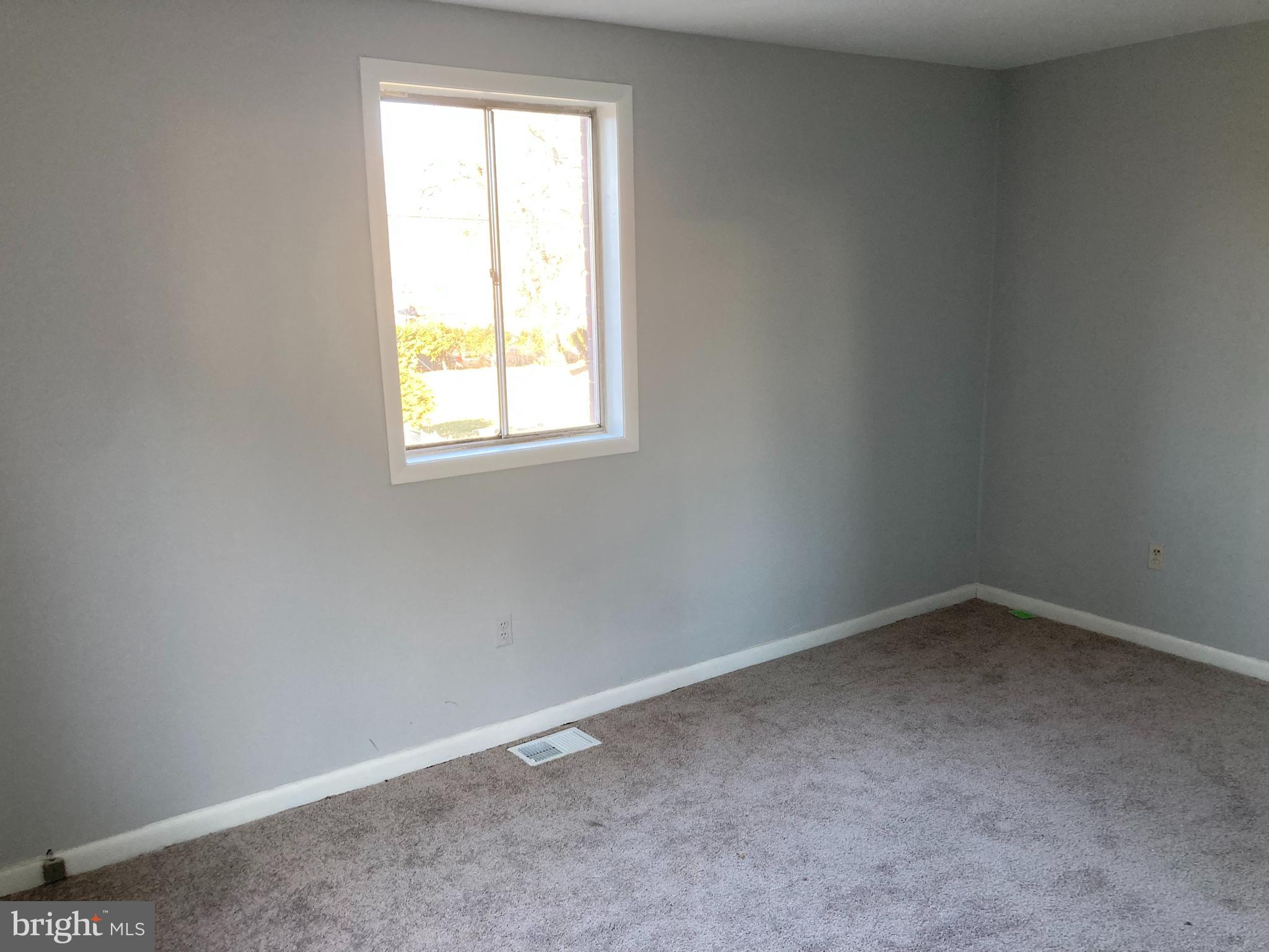 712 Alabama Avenue Southeast Washington, DC 20032 - Photo 10 of 15 an empty room with a window