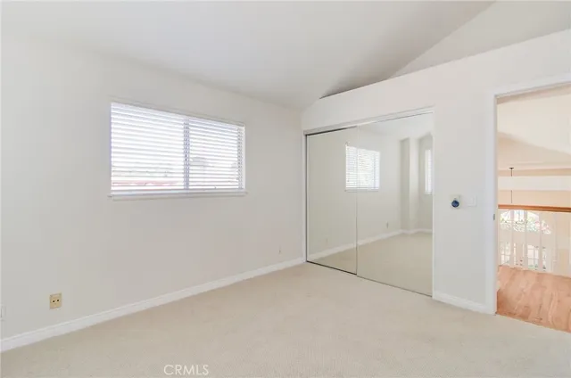a bathroom with double sink and a mirror