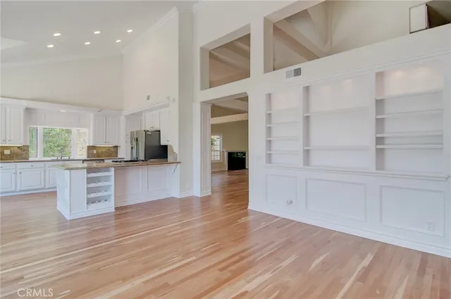 a view of kitchen with cabinets and wooden floor