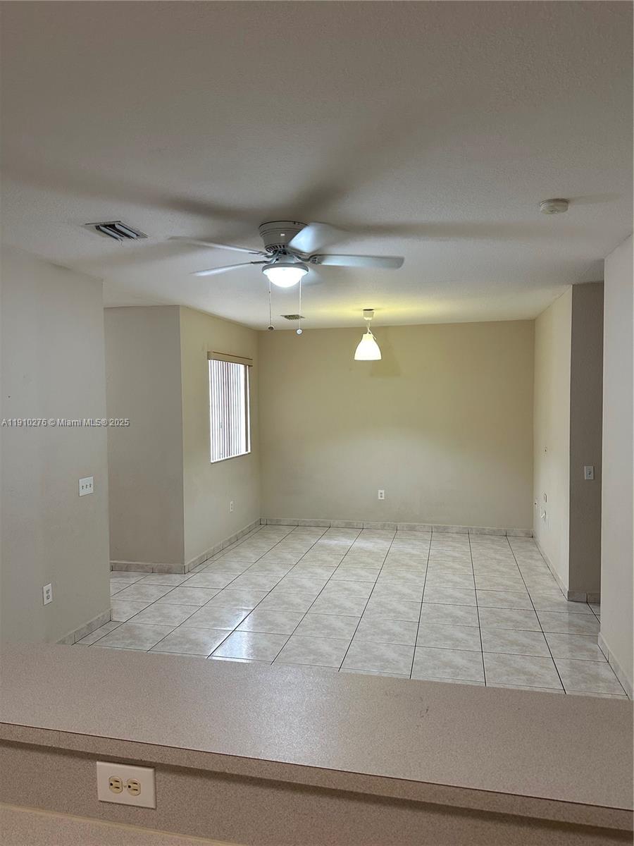 7549 Northwest 175th Street, Unit 7549 Hialeah, FL 33015 - Photo 15 of 34 a view of an empty room