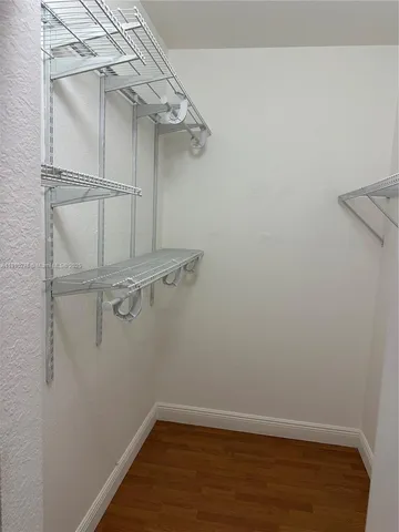 a view of a room with racks on the wall