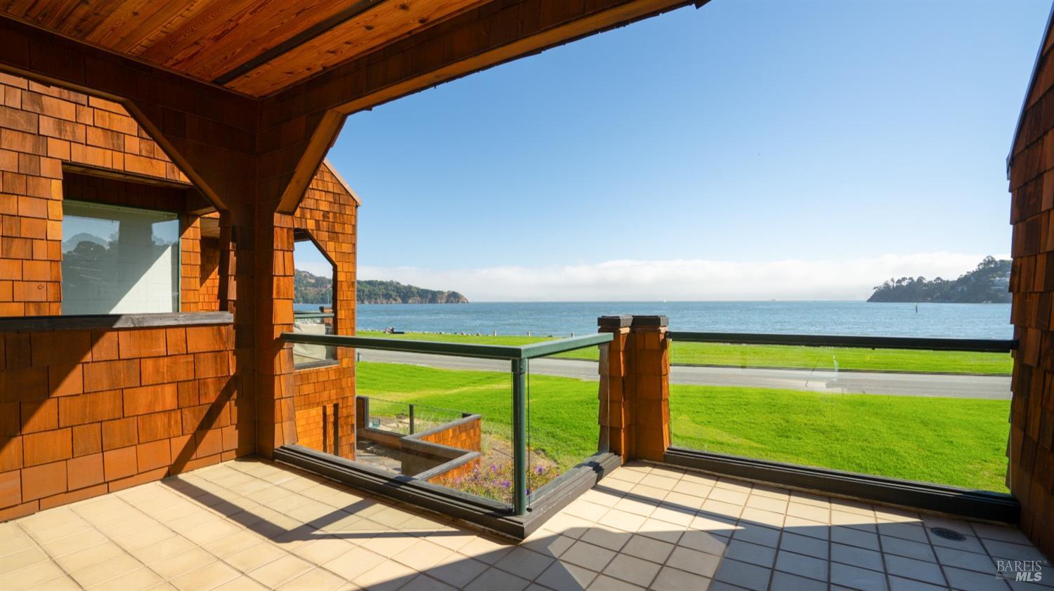 206 Paradise Drive Tiburon, CA 94920 - Photo 11 of 45 a view of an empty room with a floor to ceiling window