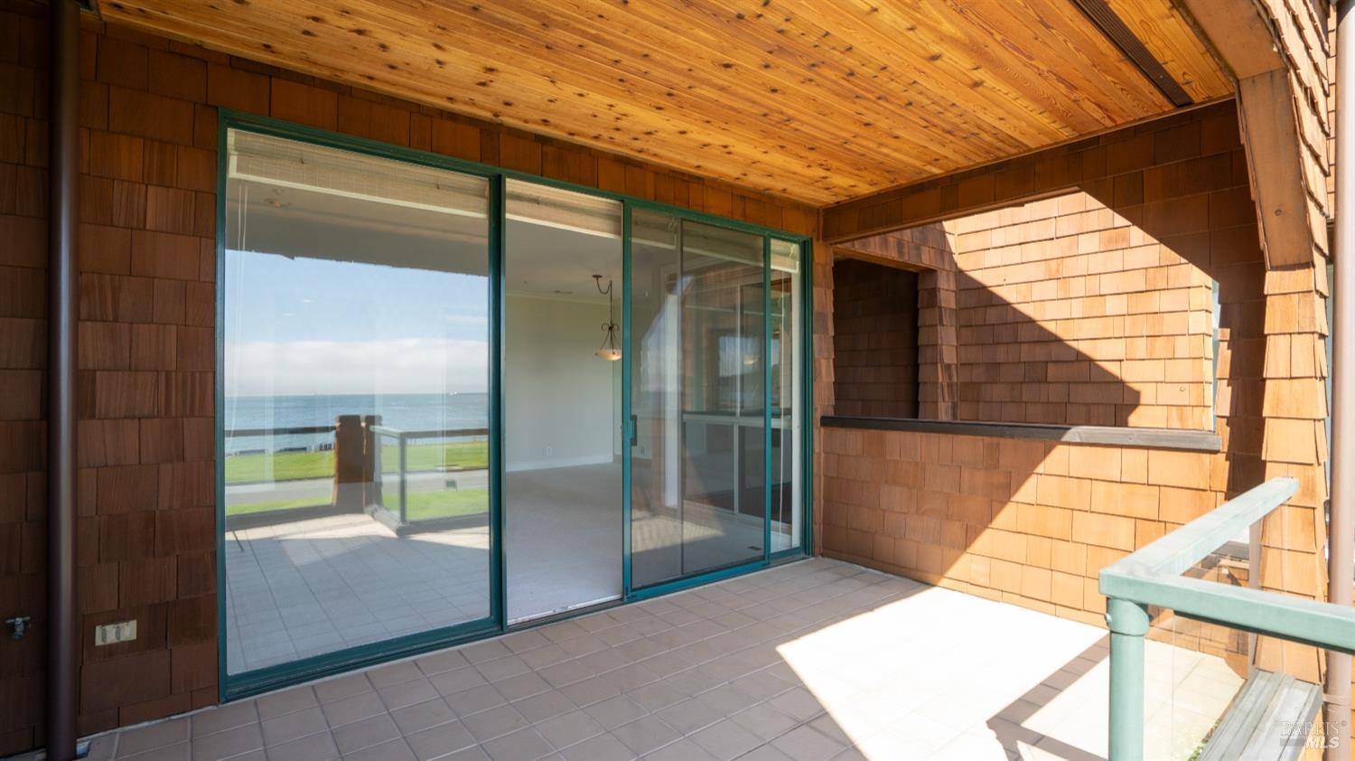 206 Paradise Drive Tiburon, CA 94920 - Photo 12 of 45 a balcony view with a glass door