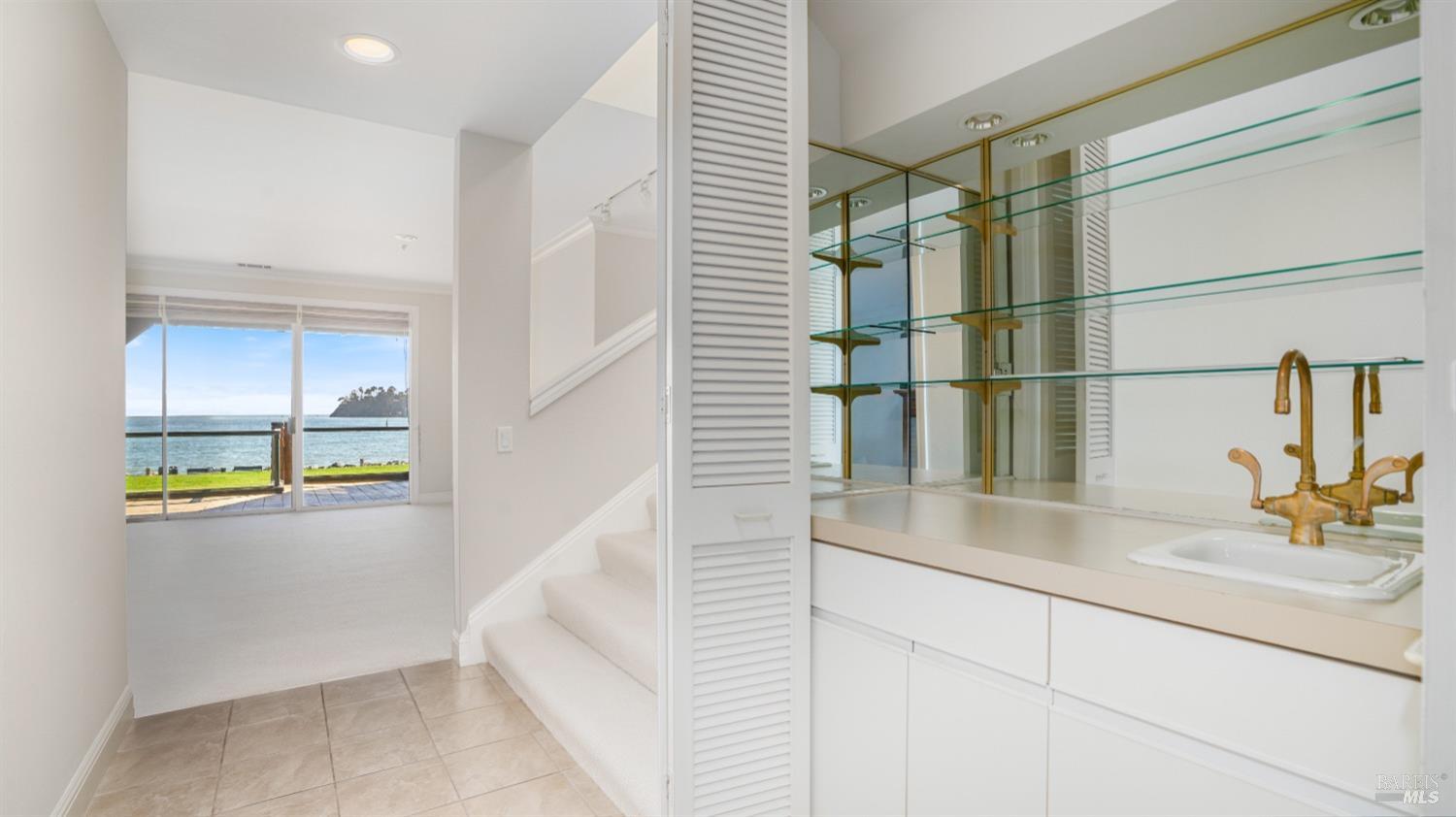 206 Paradise Drive Tiburon, CA 94920 - Photo 14 of 45 a bathroom with a sink and a window