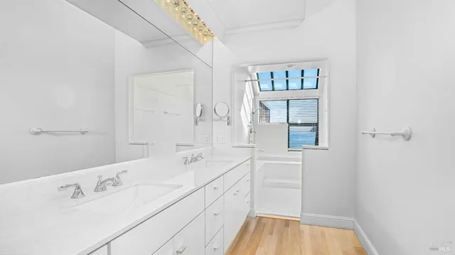 a bathroom with a bathtub and a shower