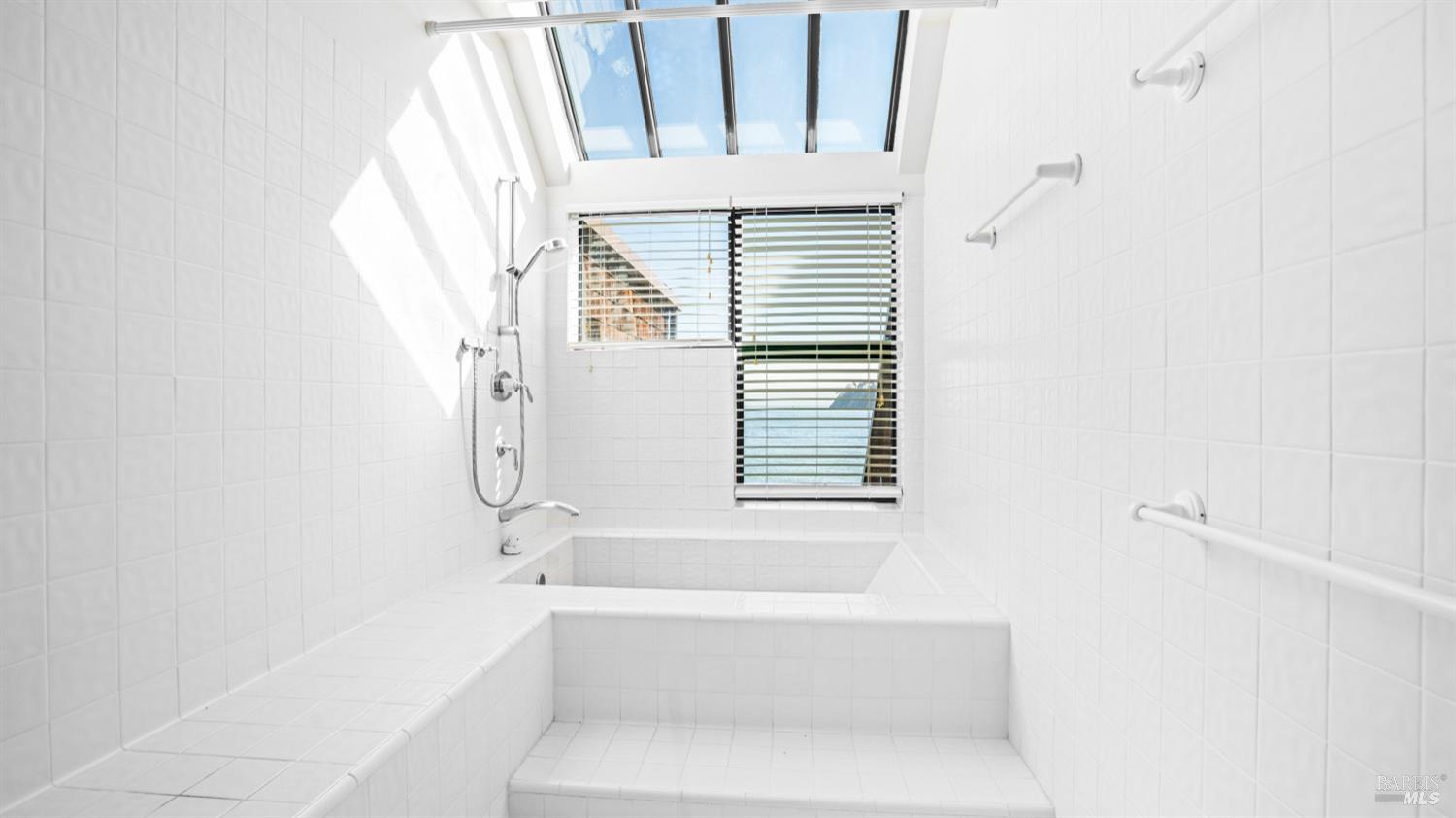 206 Paradise Drive Tiburon, CA 94920 - Photo 33 of 45 a bathroom with a bathtub and a shower