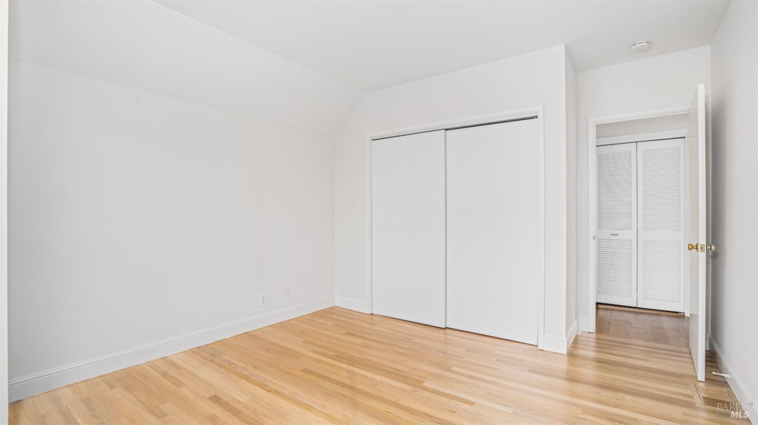 206 Paradise Drive Tiburon, CA 94920 - Photo 36 of 45 a view of empty room with wooden floor