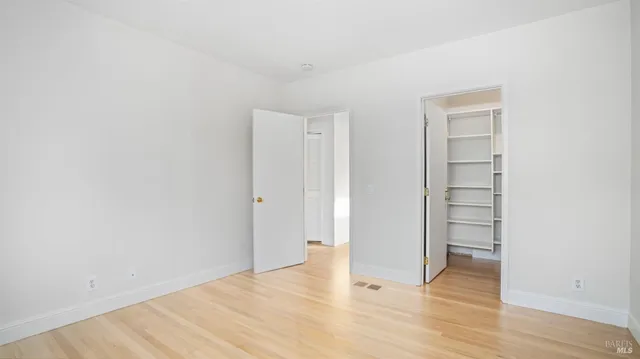 a view of an empty walk in closet
