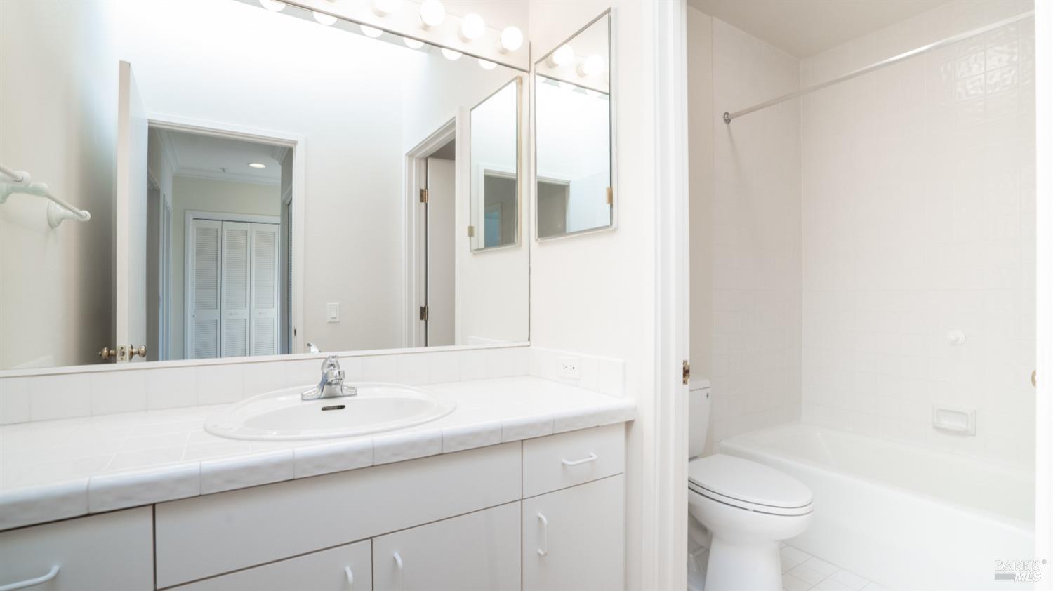 206 Paradise Drive Tiburon, CA 94920 - Photo 39 of 45 a bathroom with a sink toilet and shower