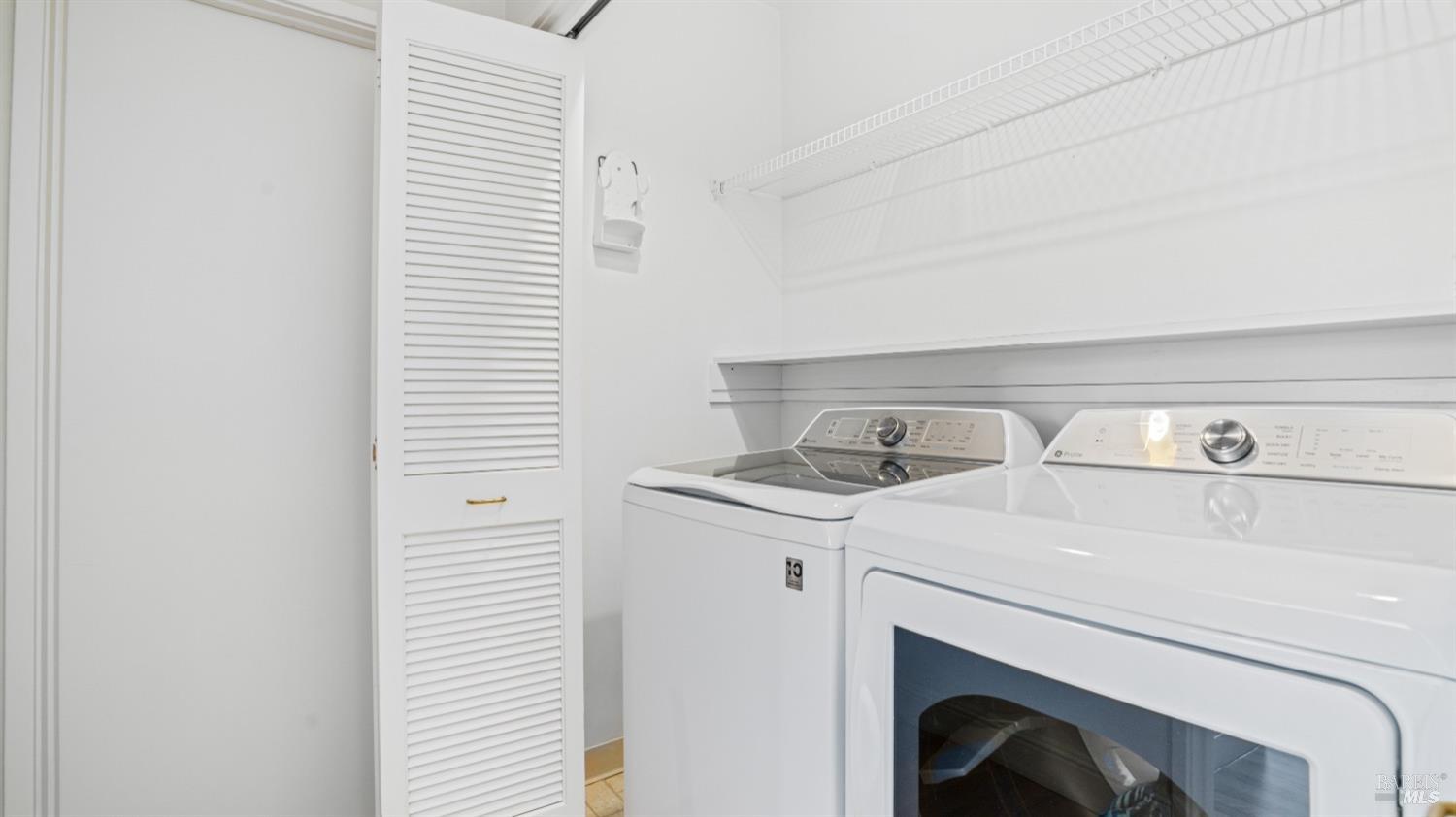 206 Paradise Drive Tiburon, CA 94920 - Photo 44 of 45 a utility room with dryer and washer