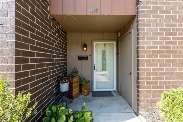 a view of a brick wall and a window