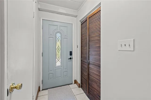 a view of a hallway with front door