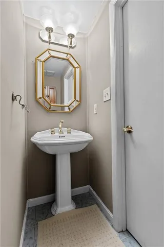 a bathroom with a sink a mirror and a toilet