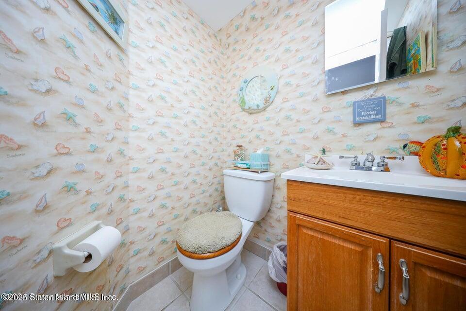 69 Token Street Staten Island, NY 10312 - Photo 19 of 22 a bathroom with a toilet and a sink