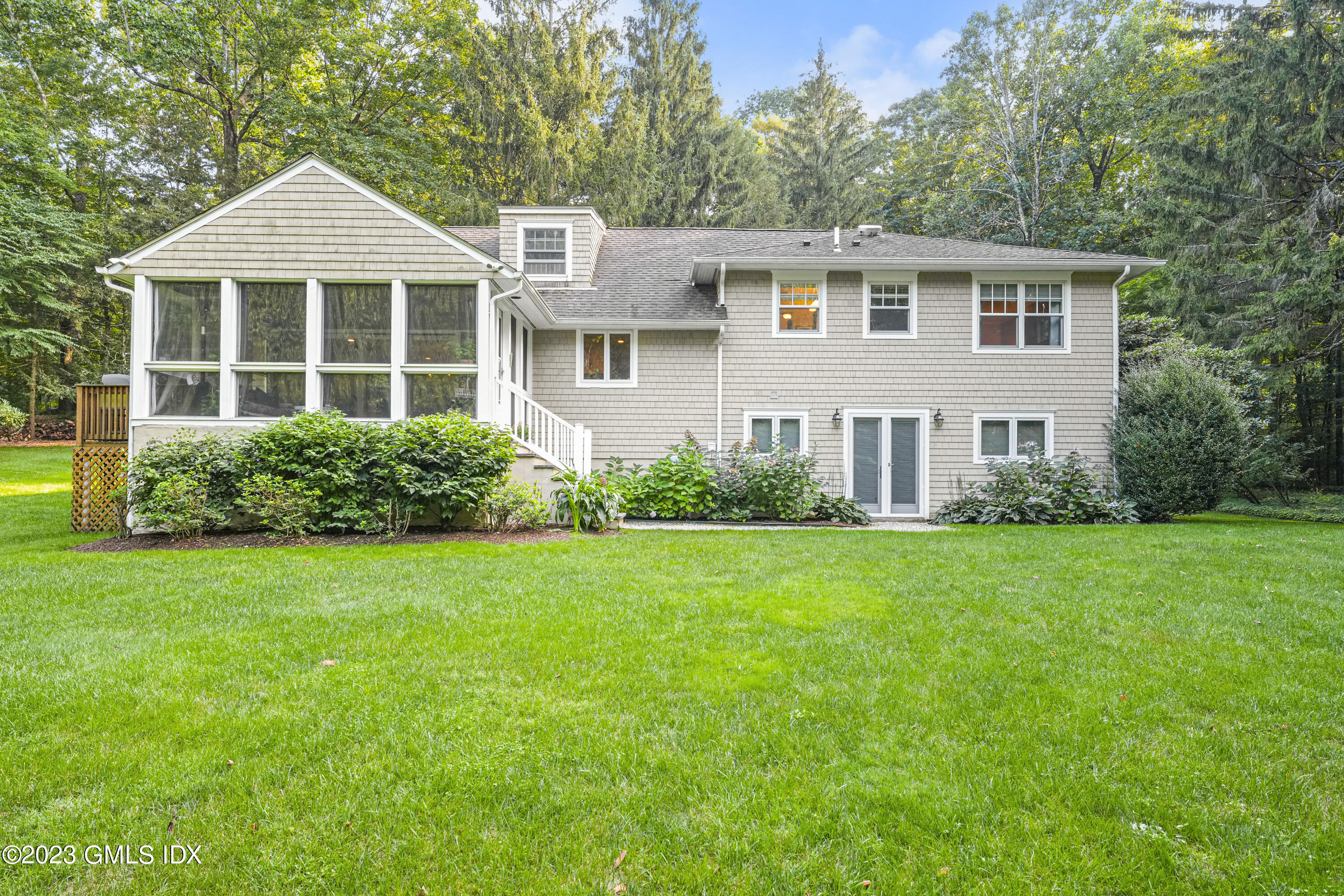21 Barton Lane Cos Cob, CT 06807 - Photo 15 of 22 a front view of a house with a yard