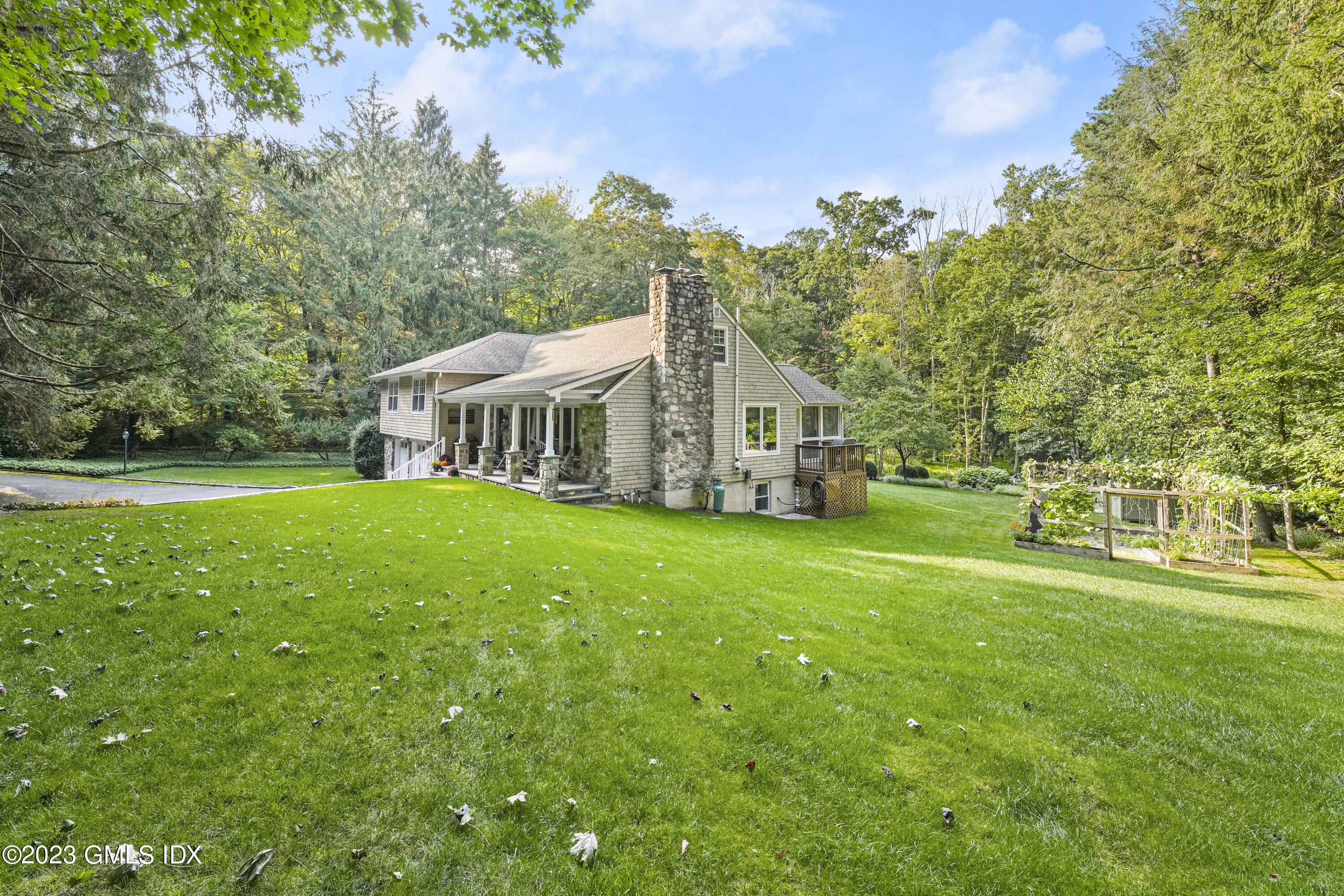 21 Barton Lane Cos Cob, CT 06807 - Photo 17 of 22 a view of house with yard and green space