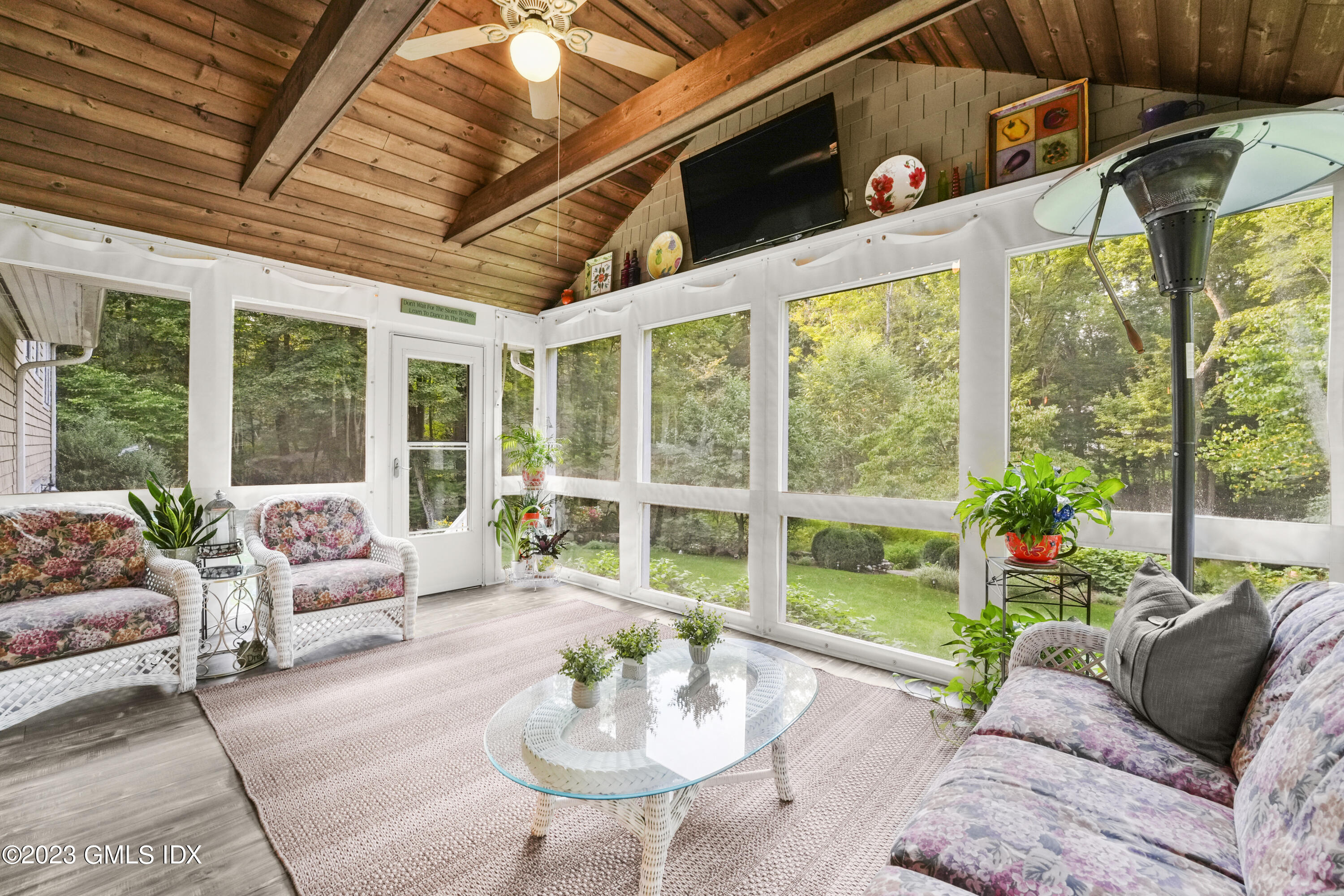 21 Barton Lane Cos Cob, CT 06807 - Photo 6 of 22 a living room with patio furniture and a floor to ceiling window
