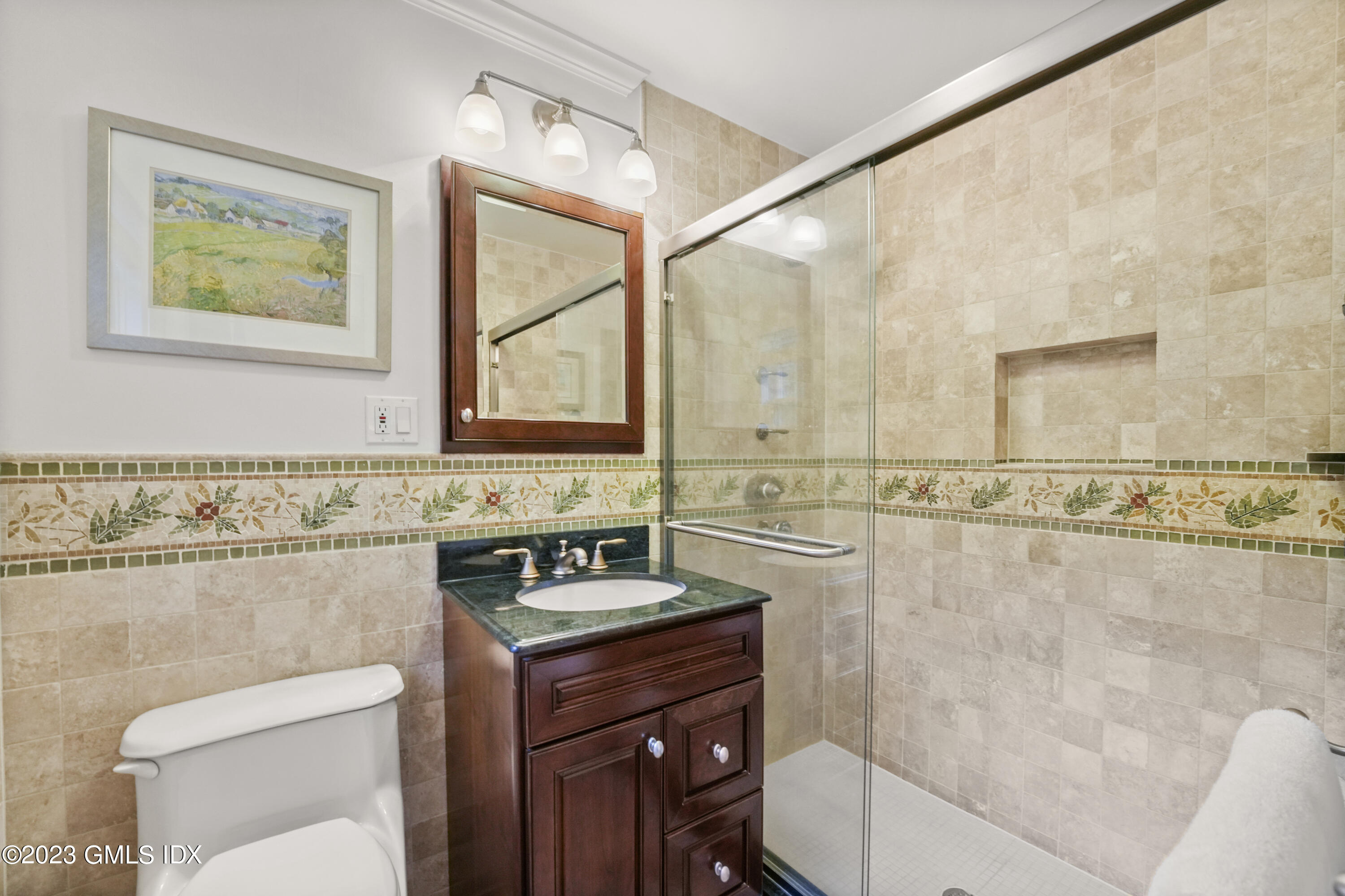21 Barton Lane Cos Cob, CT 06807 - Photo 8 of 22 a bathroom with a sink a toilet and a mirror