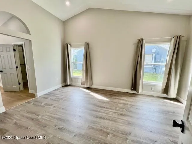 a view of an empty room with glass door