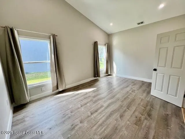 a view of an empty room with a window