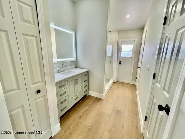 a bathroom with a double vanity sink and mirror