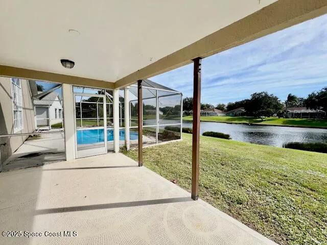 a view of a house with a big yard and sitting area