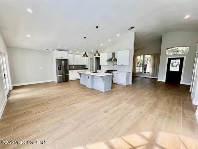 a view of a large kitchen with a sink