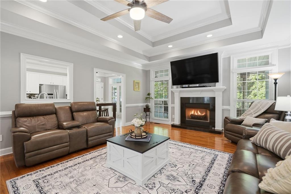 153 York Place Calhoun, GA 30701 - Photo 12 of 78 a living room with furniture a flat screen tv and a fireplace