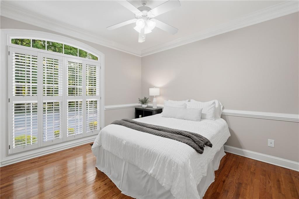 153 York Place Calhoun, GA 30701 - Photo 28 of 78 a bedroom with a large bed and a large window