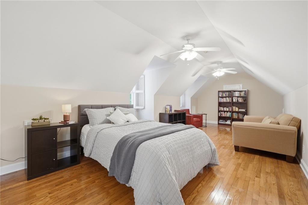 153 York Place Calhoun, GA 30701 - Photo 34 of 78 a spacious bedroom with a bed and a couch