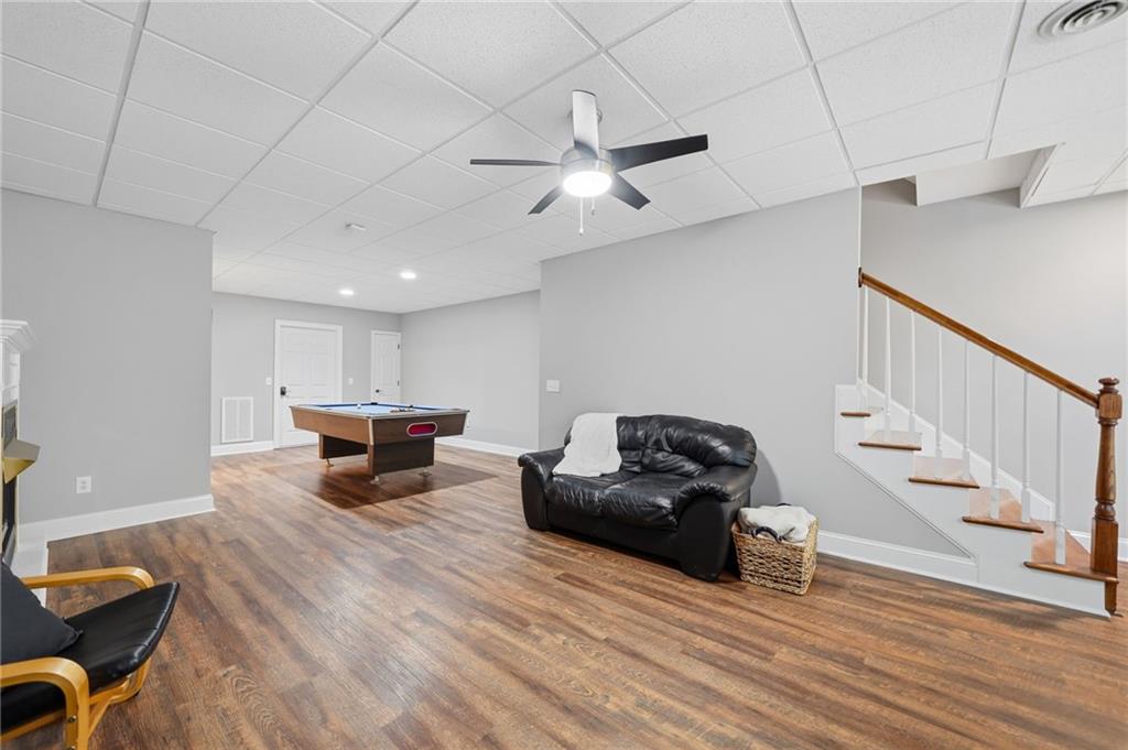 153 York Place Calhoun, GA 30701 - Photo 39 of 78 a living room with furniture and a wooden floor