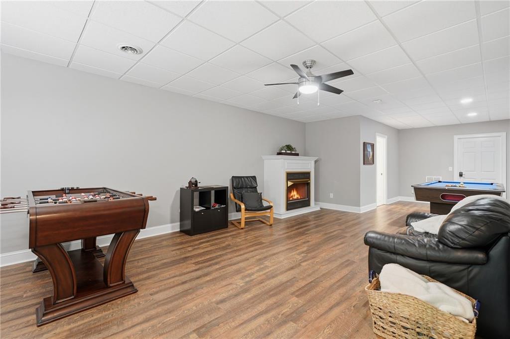 153 York Place Calhoun, GA 30701 - Photo 40 of 78 a living room with furniture and a fireplace