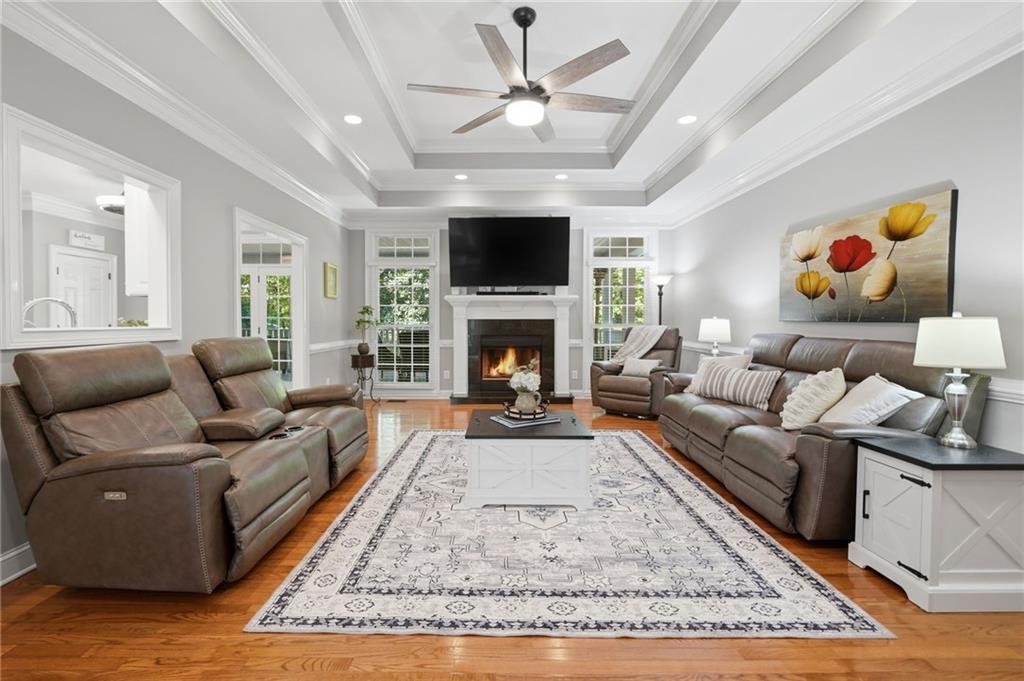 153 York Place Calhoun, GA 30701 - Photo 5 of 78 a living room with furniture a flat screen tv and a fireplace