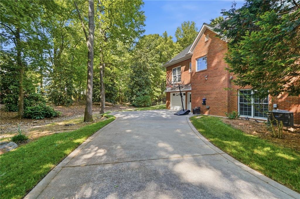 153 York Place Calhoun, GA 30701 - Photo 68 of 78 a pathway of a house with a yard