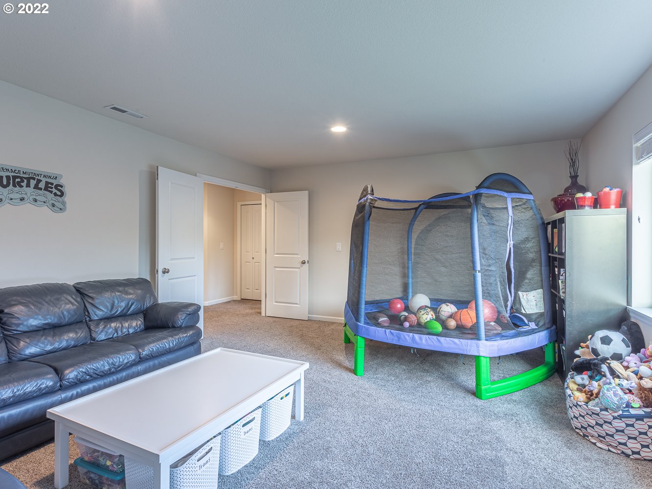 17656 Southeast Pinnacles Street Damascus, OR 97089 - Photo 20 of 31 a living room with furniture and a wooden floor