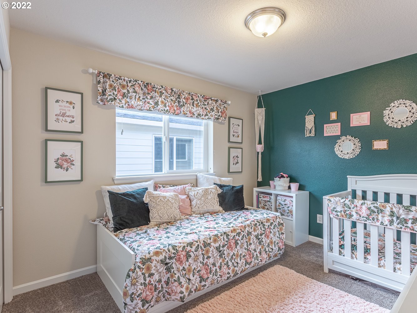 17656 Southeast Pinnacles Street Damascus, OR 97089 - Photo 22 of 31 a bedroom with a bed and window