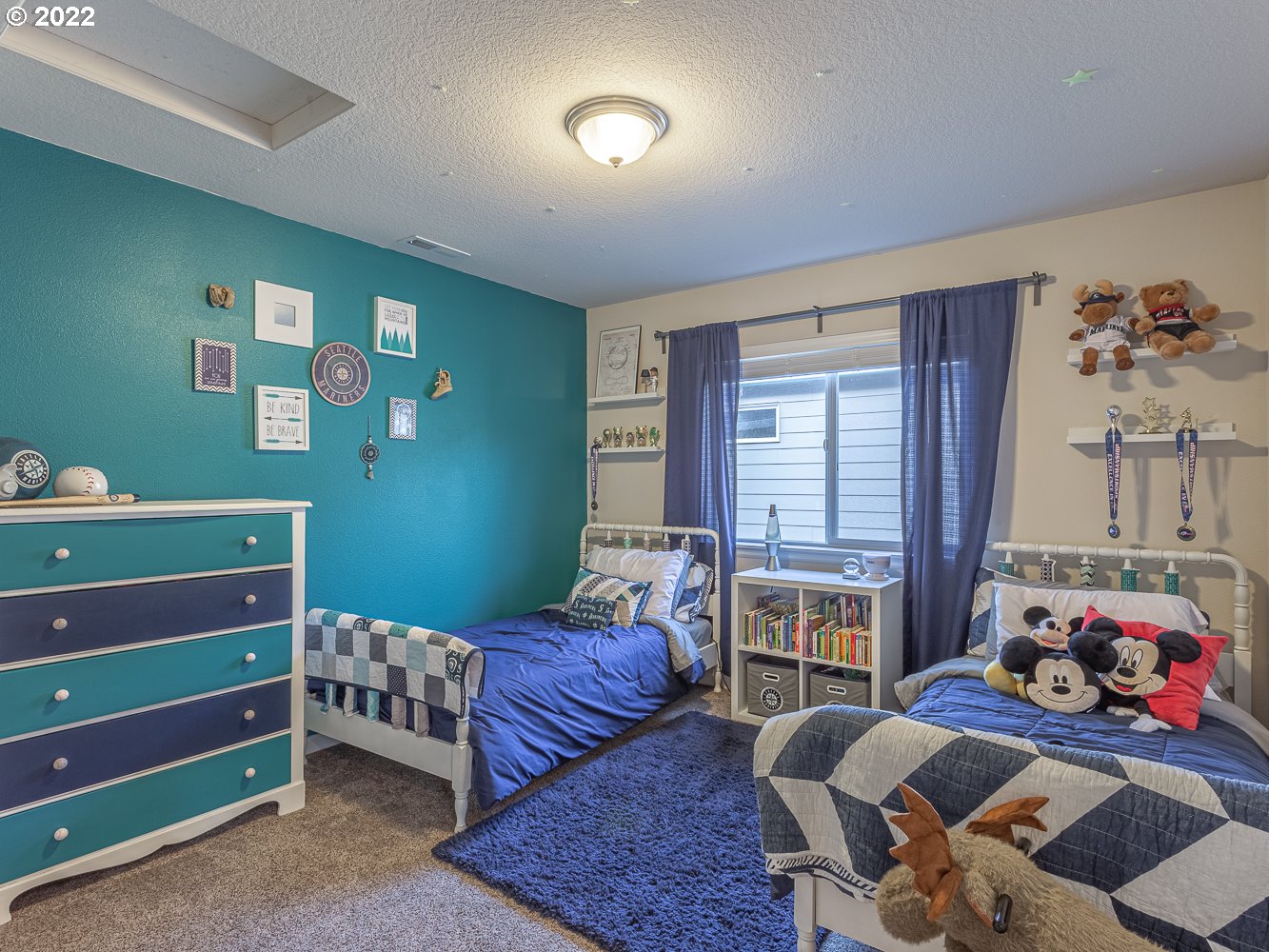 17656 Southeast Pinnacles Street Damascus, OR 97089 - Photo 25 of 31 a bedroom with furniture and a window